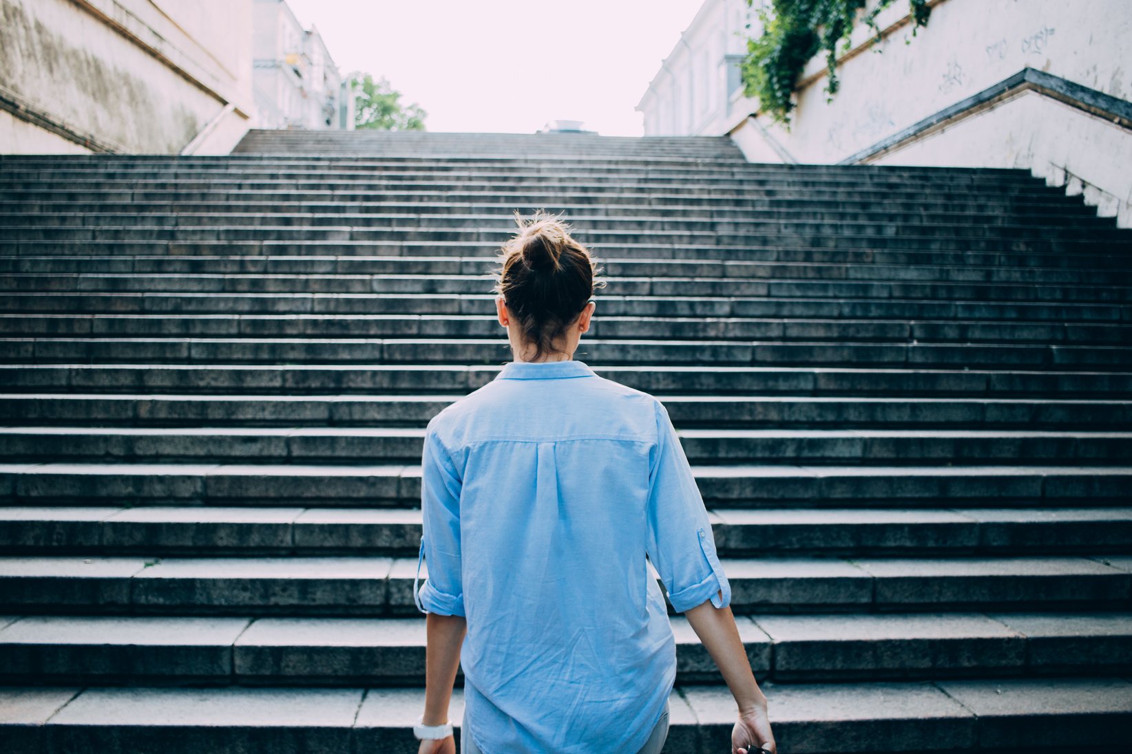 Woman Climbing Up the Stairs 